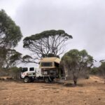 Our truck camper set up camping on the 90 Mile Straight between Balladonia and Caiguna, Nullarbor Plain.