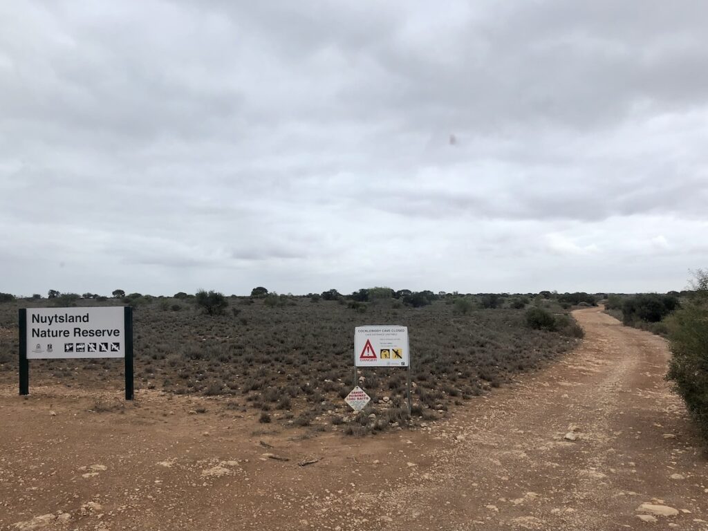 The turnoff to Cocklebiddy Cave at the Eyre Highway.