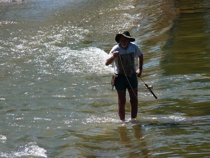 Saltwater Crocodiles- Fisherman taking his chances on Cahills Crossing, Kakadu NT