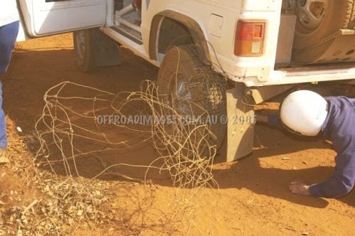 Pajero ute at Condo 750 off road event - tangled in a fence