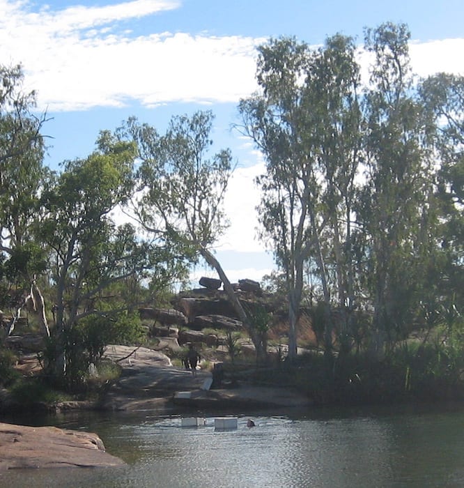 Floating their gear across the Manning River in styrofoam boxes. Mount Barnett Campground.