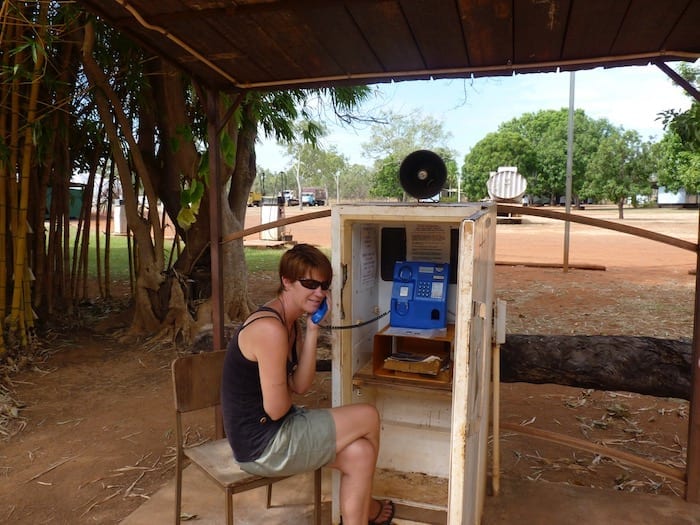 Peta making a call from the fridge phone at Drysdale Station. King Edward River.