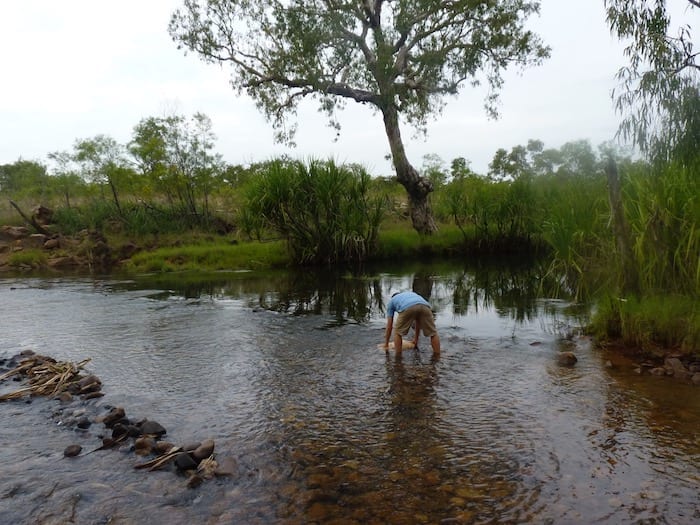 Filling a jerry can at King Edward River crossing.