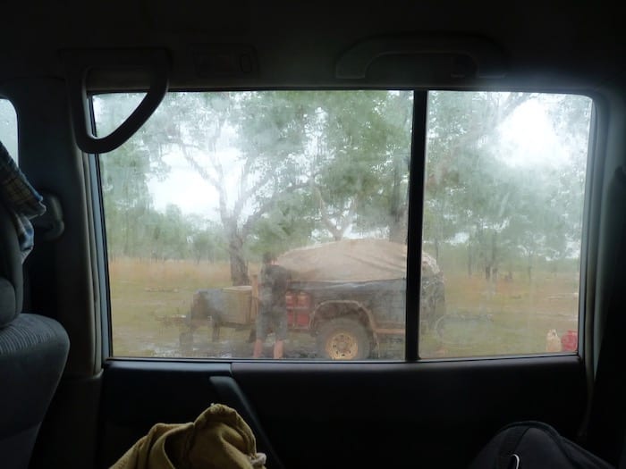 Packing down the camper trailer in pouring rain at King Edward River Campground. Kalumburu Road.