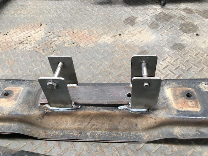 The rear engine mount after welding to the crossmember.