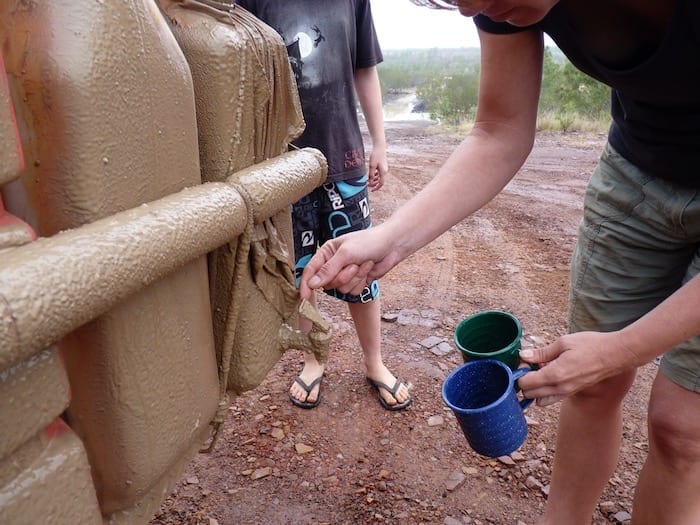 How to get a mug full of mud-free water? Muddy Gibb River Road.