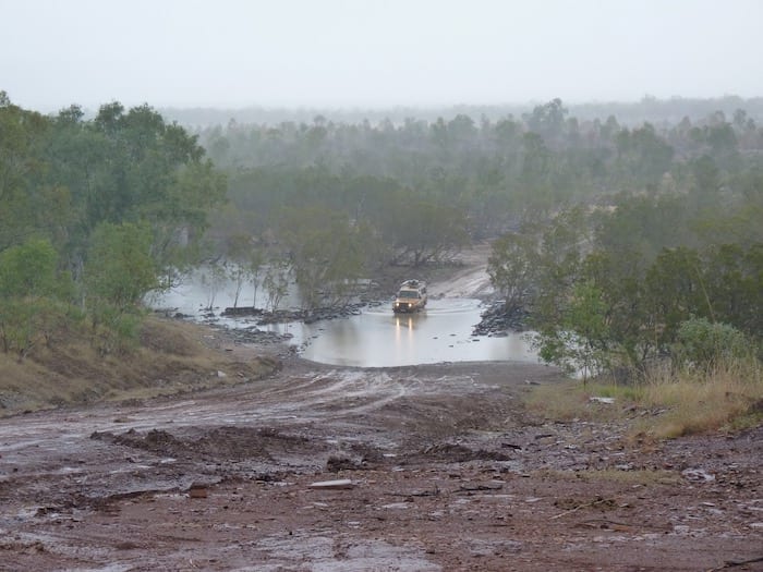 A Troopie crossing Durack River. Muddy Gibb River Road.