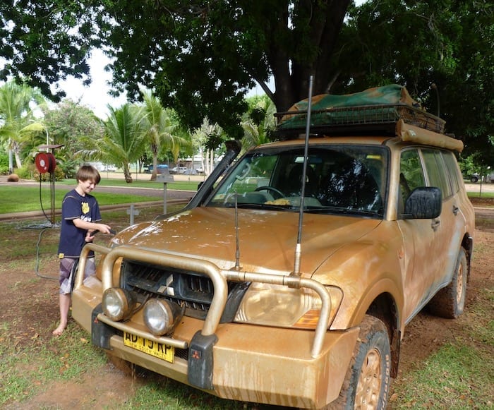 Attempting to find the original silver colour underneath the mud. Muddy Gibb River Road.