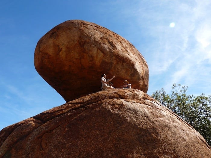 Having a yarn high above the ground. Devils Marbles.