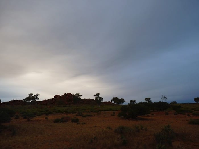 A cold, wet sky. Devils Marbles.