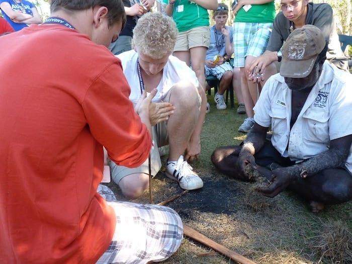 Two American boys (unsuccessfully) attempting to light a fire. It's really quite difficult. Manyallaluk, Northern Territory.