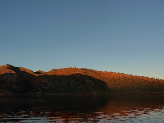 Sun setting on the mountains. Lake Argyle Cruises.