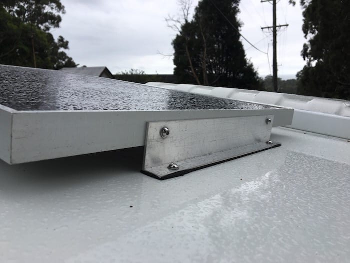 12V Solar Panel showing neoprene between bracket and top of storage box.