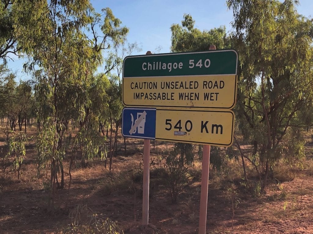 Sign warning of bad road conditions in the wet and no fuel for 540km. Burke Developmental Road Conditions.