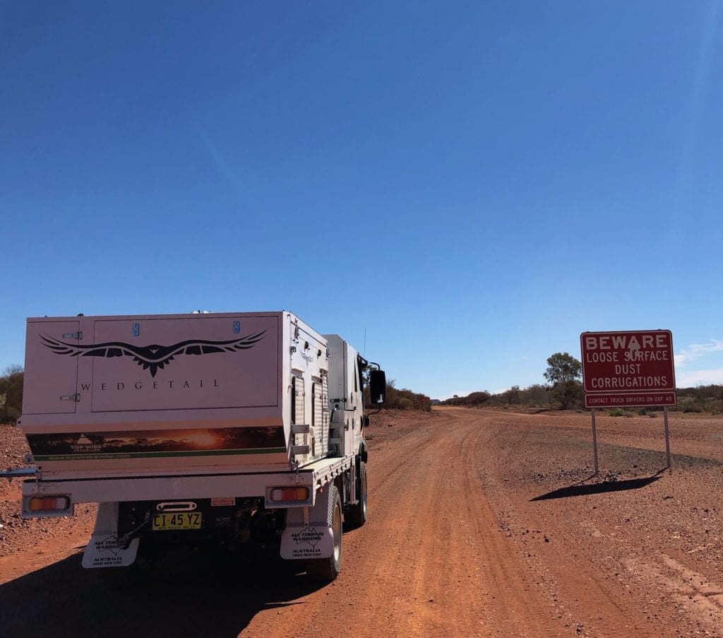 Sign warning of road conditions on Tanami track. Correct tyre pressure is critical on a road like this.