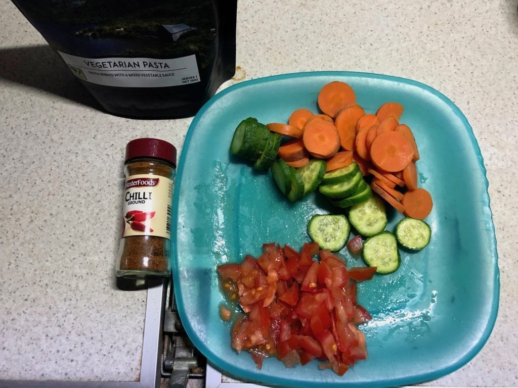 We added ground chilli, tomatoes, Lebanese cucumber and carrots to Campers Pantry Vegetarian Pasta.