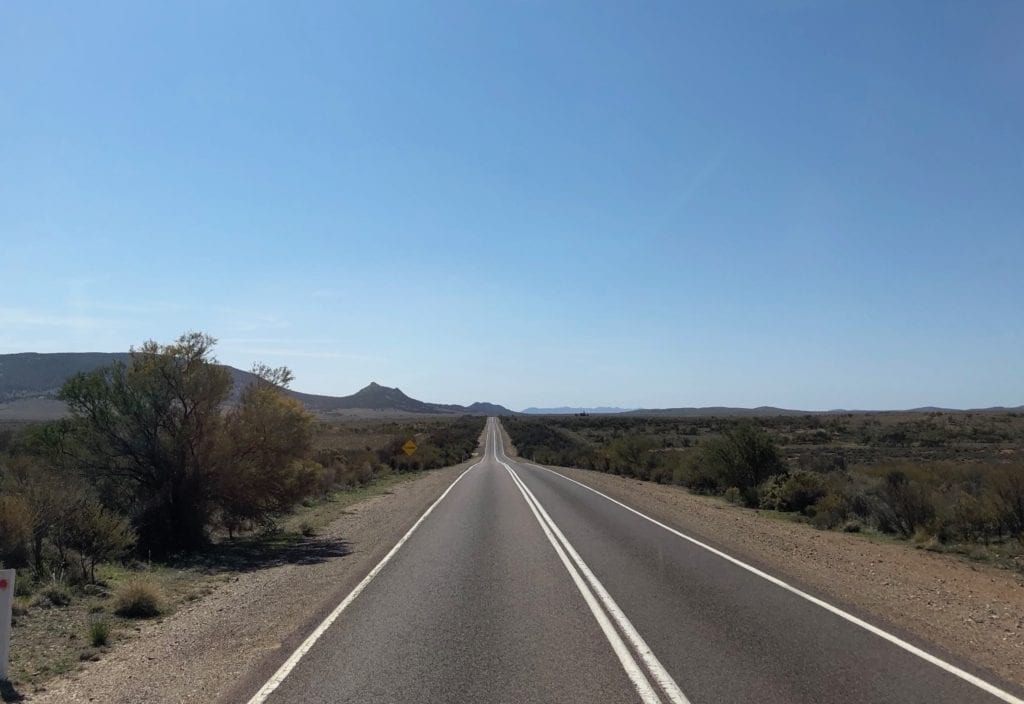 Approaching Hawker, north of Quorn SA. Old Ghan rail embankment just off the road to the right.