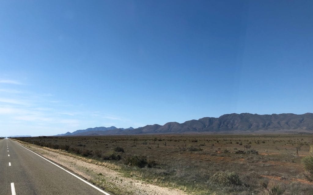 The Flinders Ranges and bluebush country, north of Quorn SA. Old Ghan rail embankment just off the road.