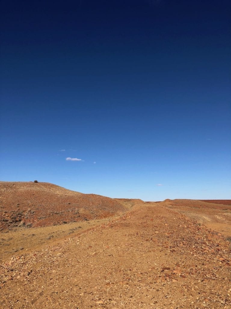 Old Ghan rail embankment at North Creek. Tough country. Salt Lakes and Water.