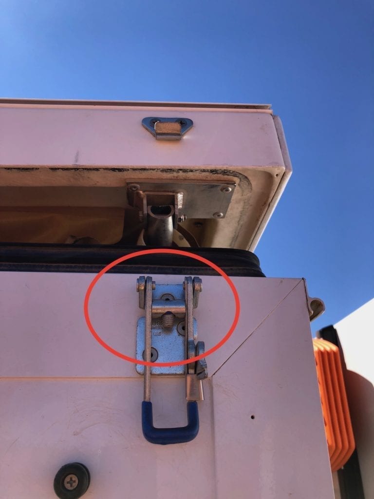 Broken latch on camper, a casualty of hours of constant slow speed pounding on the Finke track.