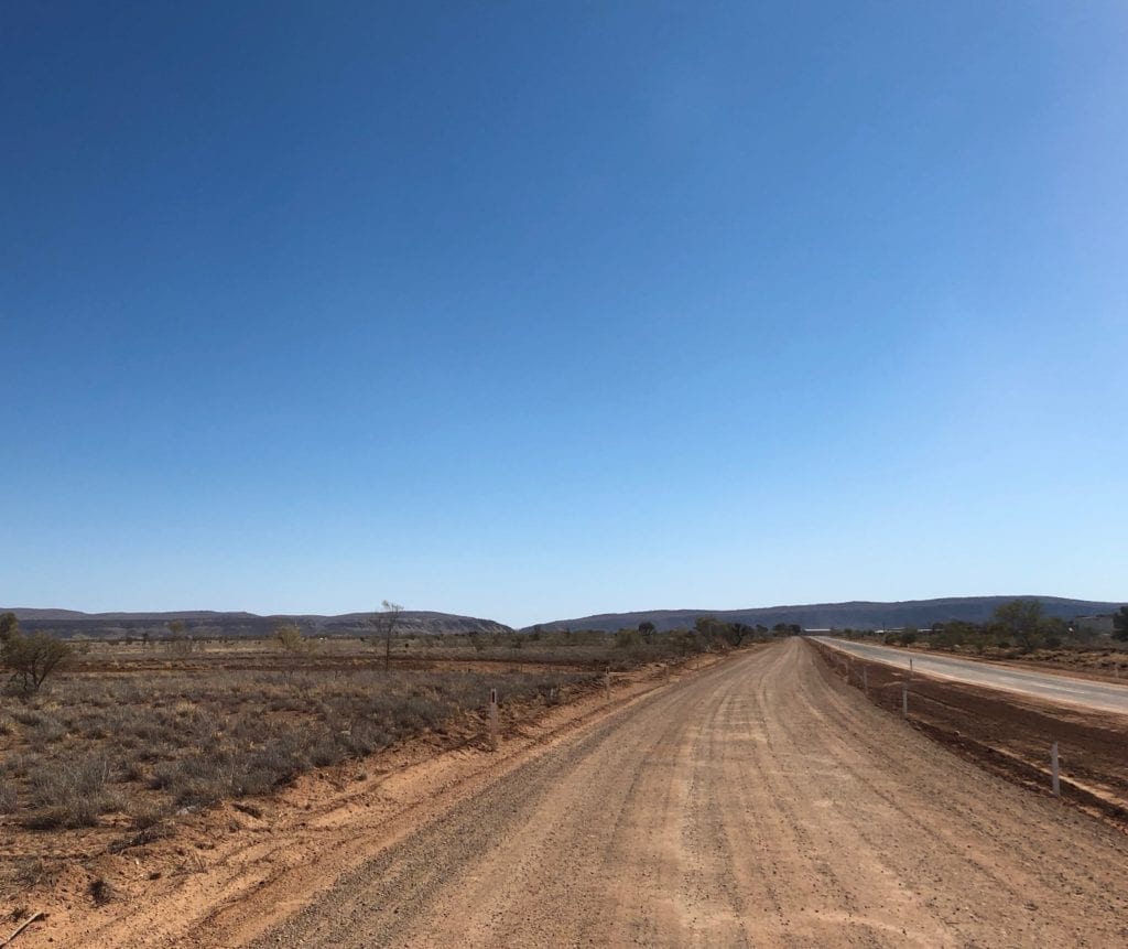 The MacDonnell Ranges are a welcome sight after driving on the Finke track.