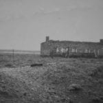 An abandoned rail building between Marree and Oodnadatta. Taken from the Old Ghan in 1950. Salt Lakes and Water.