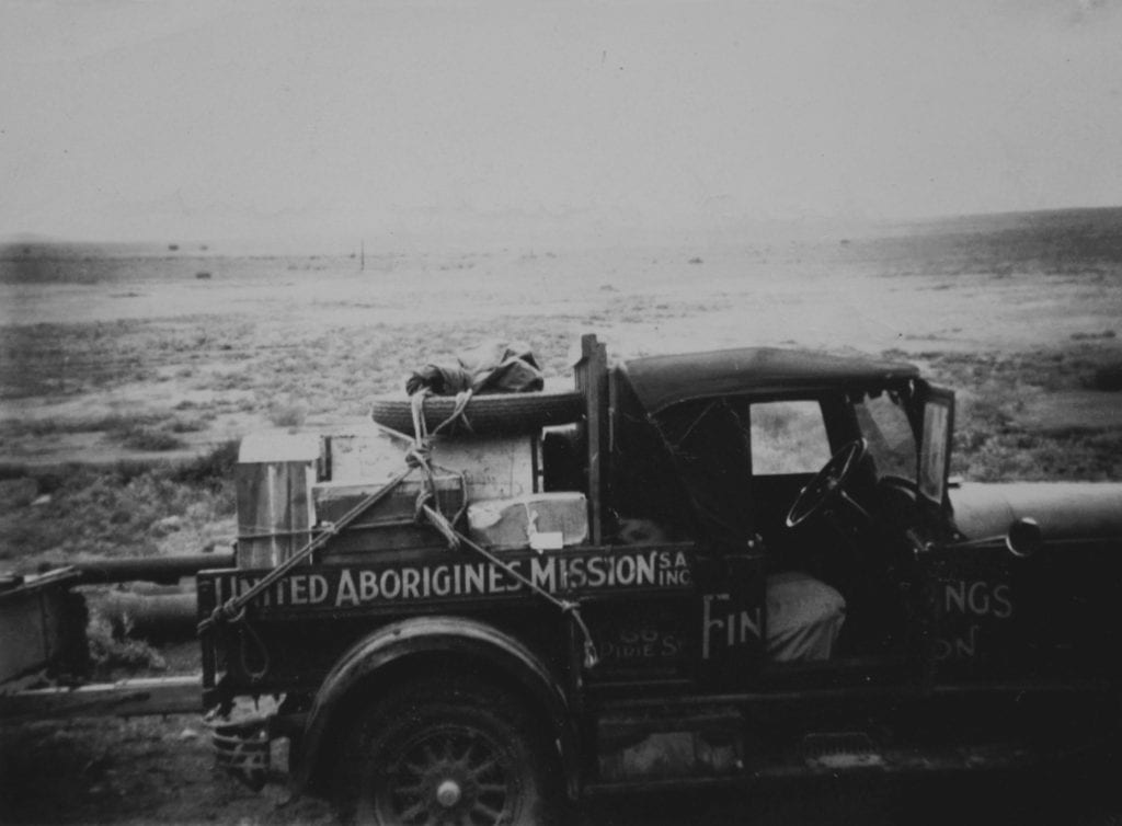 Taken from the Old Ghan in 1950. "In desert country near Oodnadatta S.A. Overland telegraph line in background." Salt Lakes and Water.