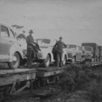 Vehicles being loaded at Quorn S.A. Two fellows from Richmond River doing round trip via Darwin, Cairns etc also "Sally". Old Ghan.