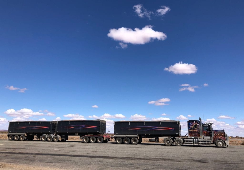 From side-on, you get a feel for how long some of these road trains are. Road safety.