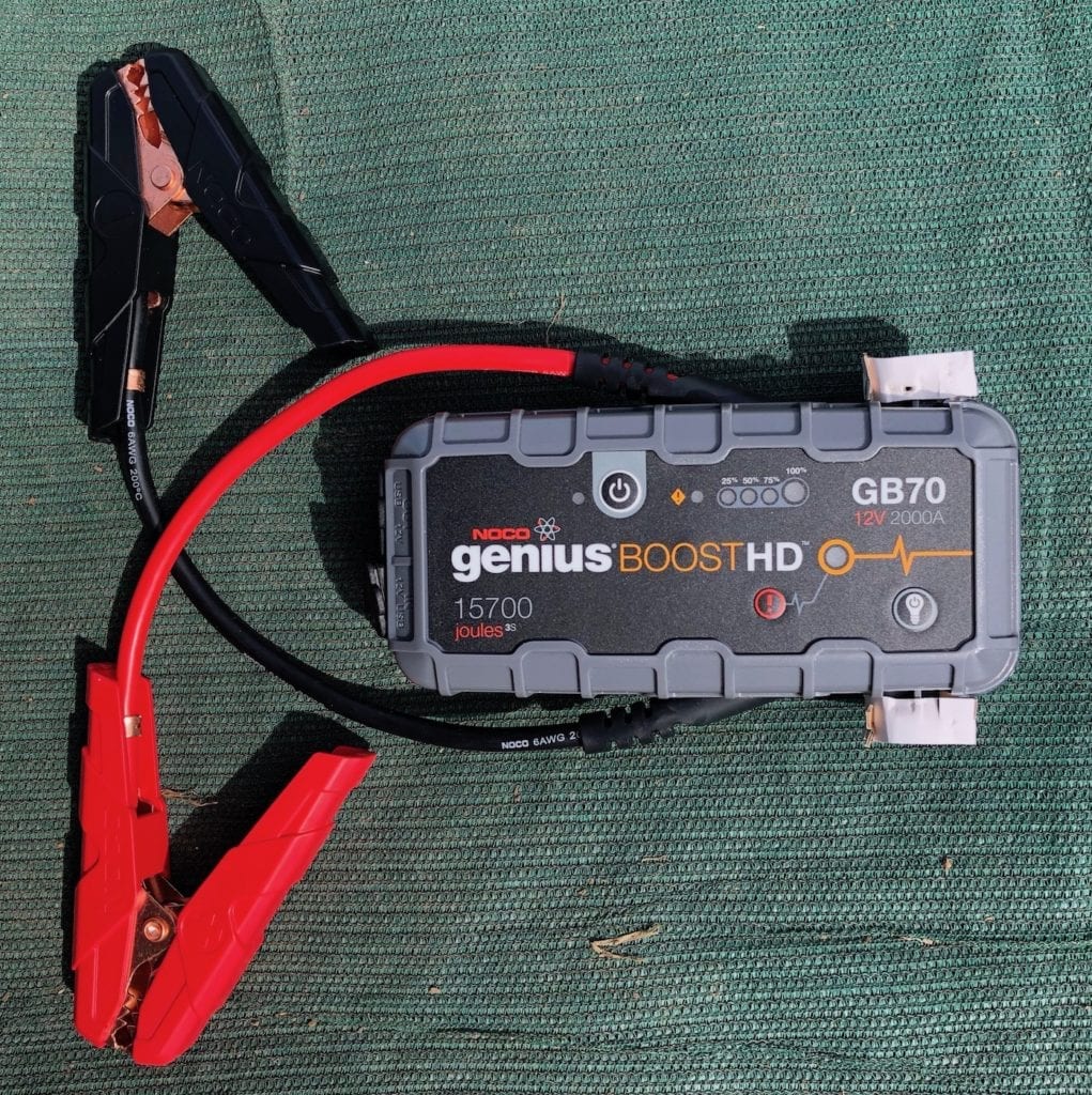 NOCO Genius Boost GB70 portable jump starter showing jaw clamps.