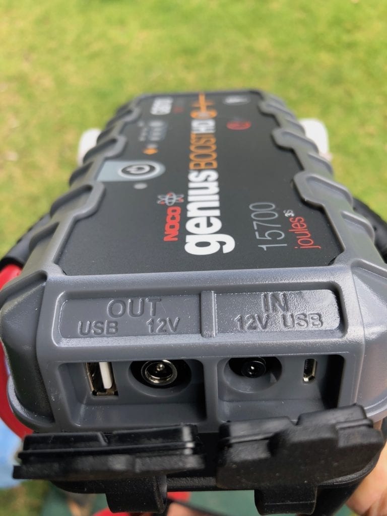 The NOCO Genius Boost GB70 portable jump starter has clearly marked input and output connections.