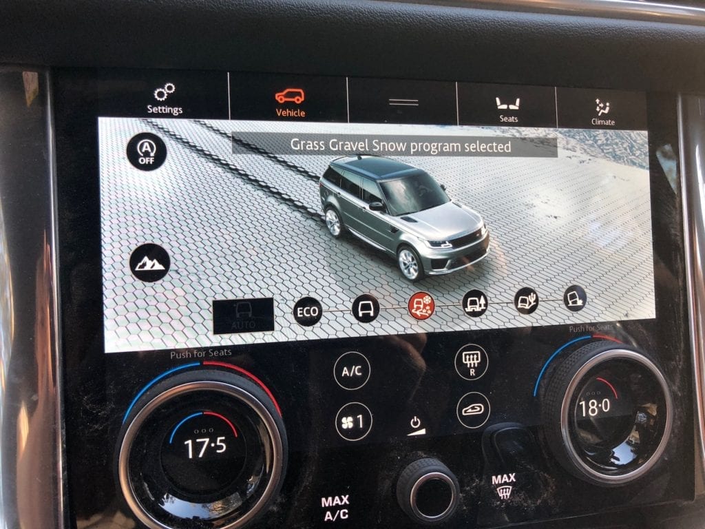 Selecting the correct mode on the in-dash display of the Range Rover Sport.