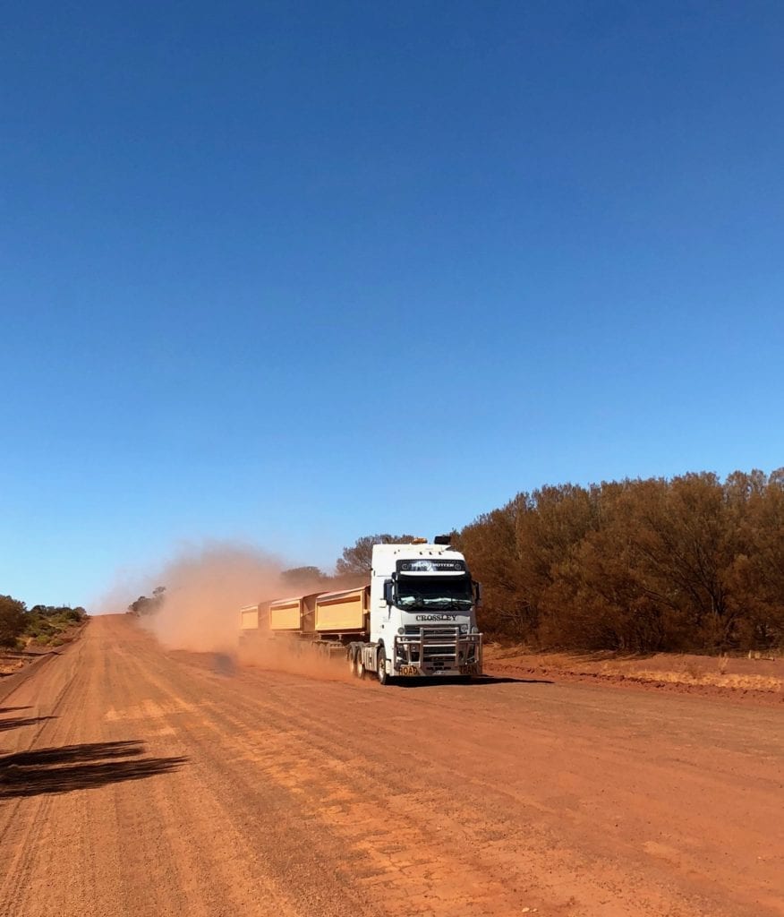 Pulling over for a triple road train on the Great Central Road.