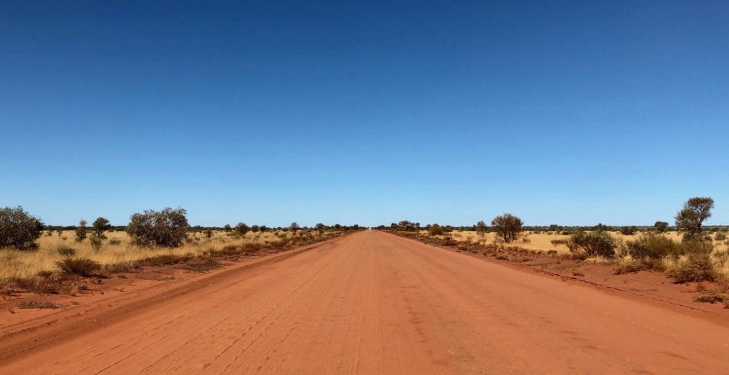 Red sandy roads and white spinifex on the Great Central Road. This is more like it!