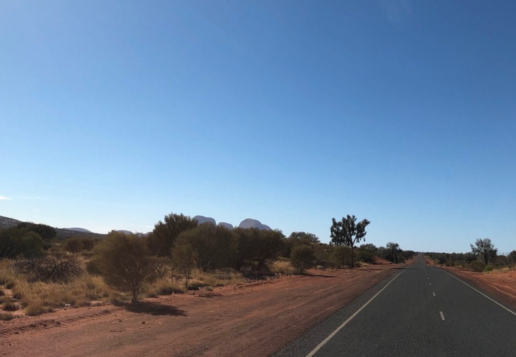 Kata Tjuta rising out of the desert. Great Central Road, Great Victoria Desert.