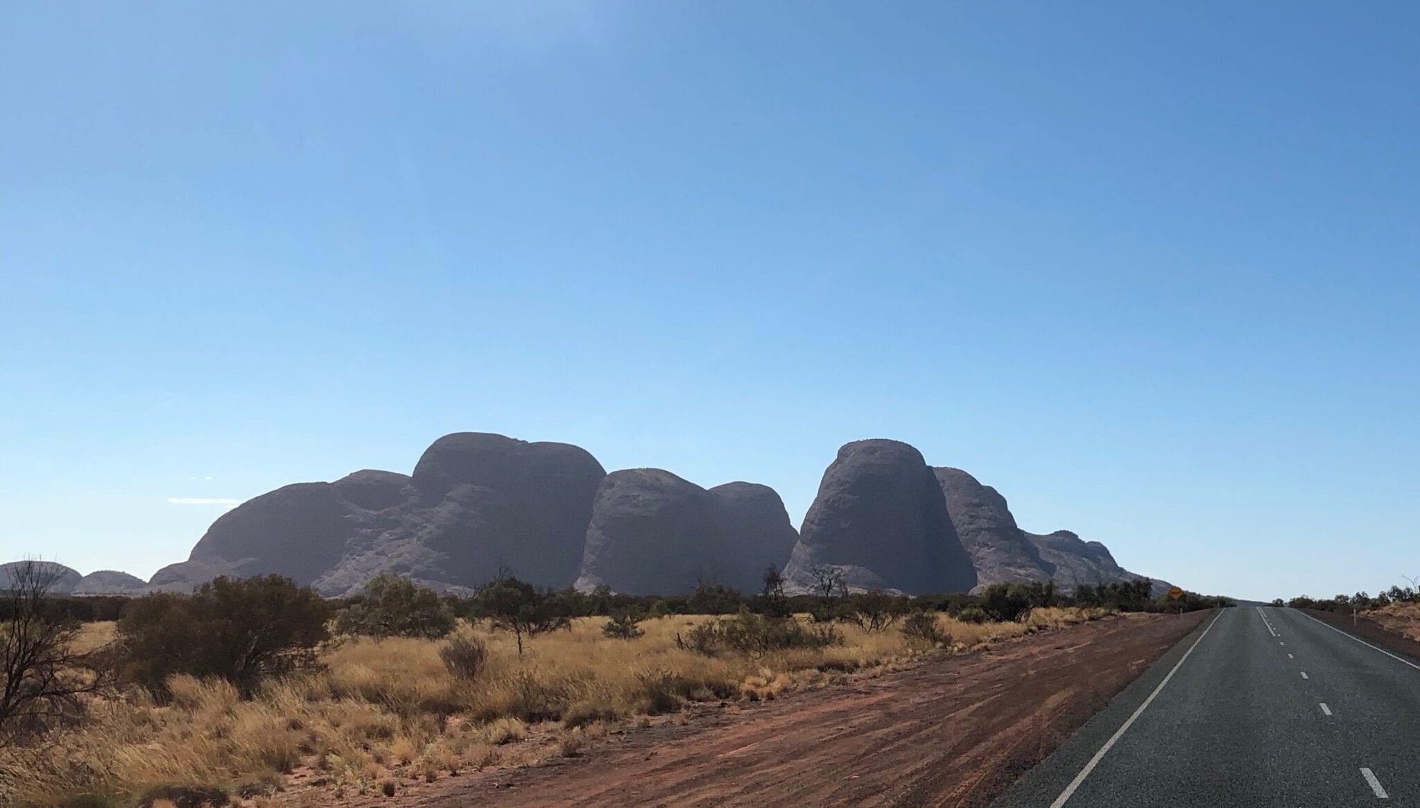 The mysterious domes of Kata Tjuta taking shape as we drive east along the Great Central Road.