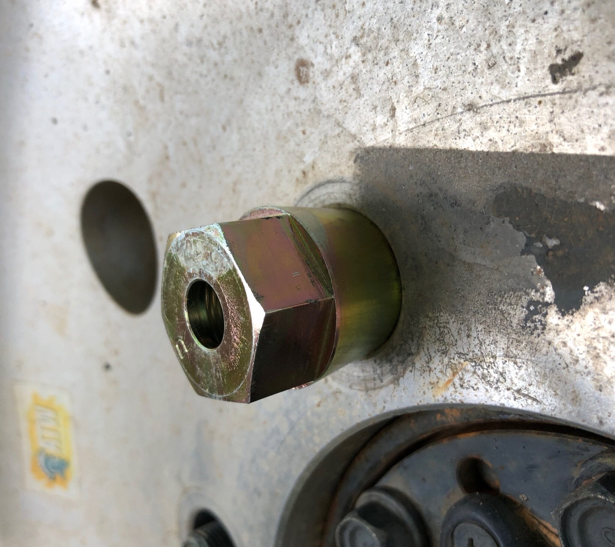 A close up of a locating nut being used to centre an ATW alloy rim.