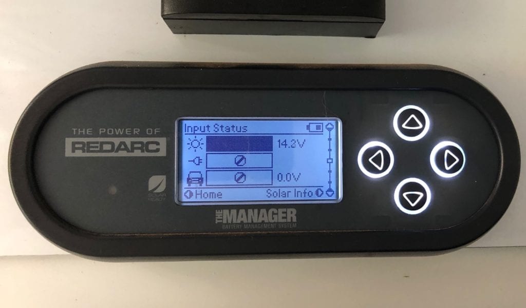 The REDARC battery monitor showing the input voltage with two solar panels connected.