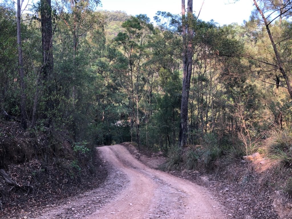 The track drops steeply down to the river at Dry Creek Camping Area. Bush camping near Canberra.