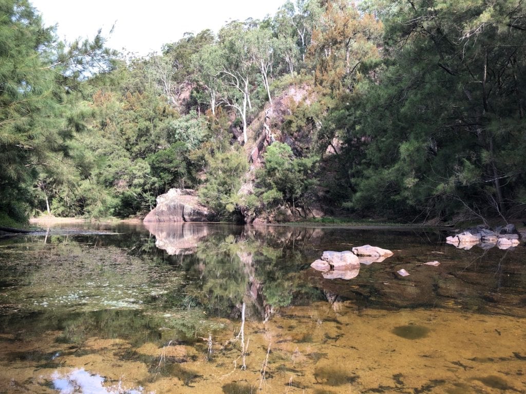 Reflections in the water at Dry Creek Camping Area. Bush camping near Canberra.