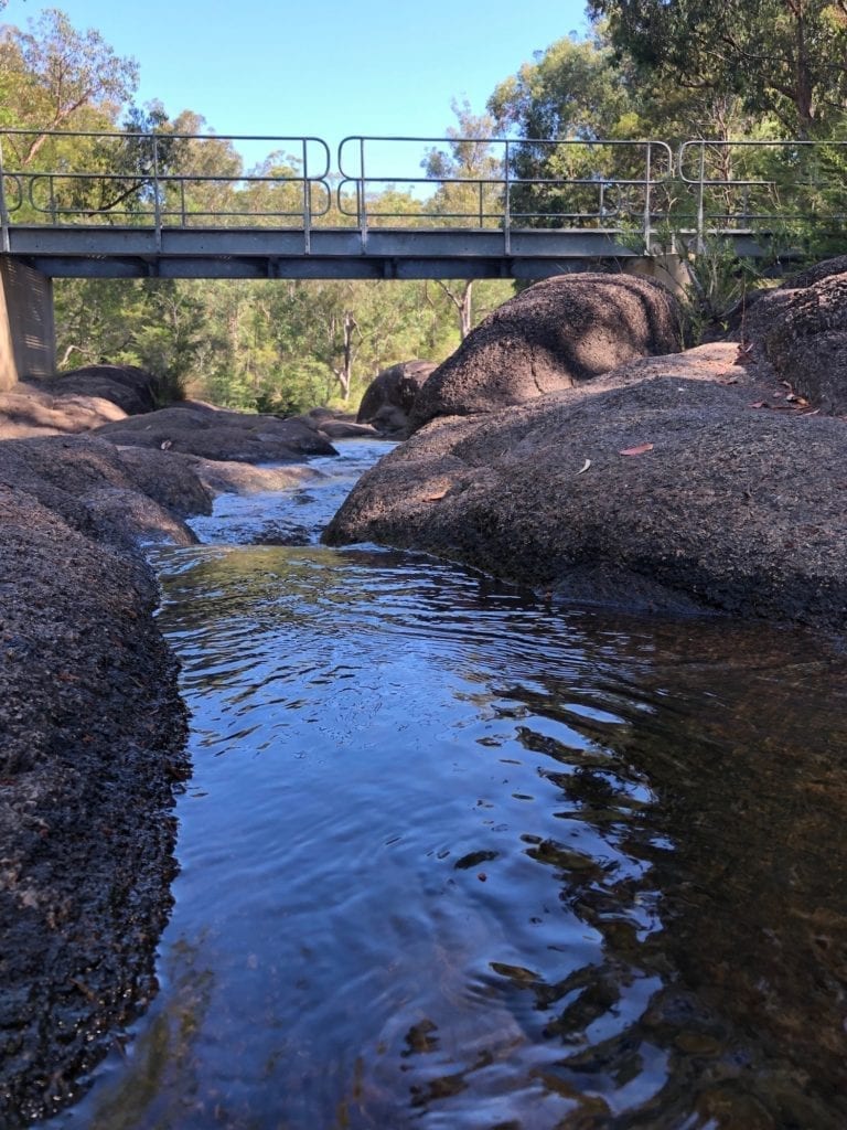 The foot-bridge and Little Dandahra Creek at Mulligans Hut campground, Gibraltar Range National Park.