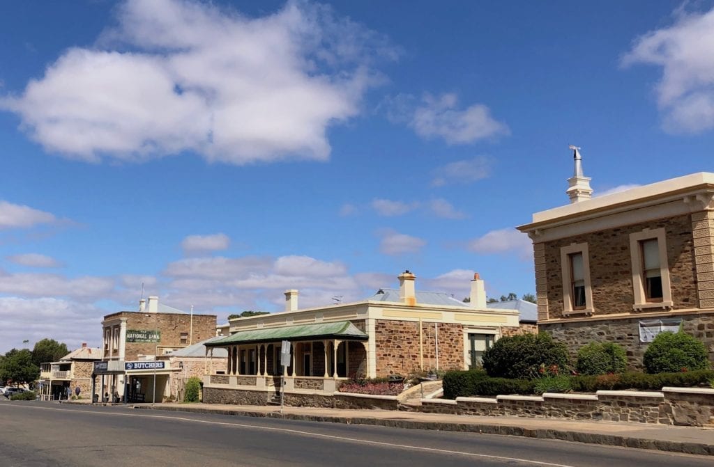 Ornate stone buildings line the main street of Burra South Australia.