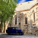 A vintage car outside the catholic church in Burra South Australia.