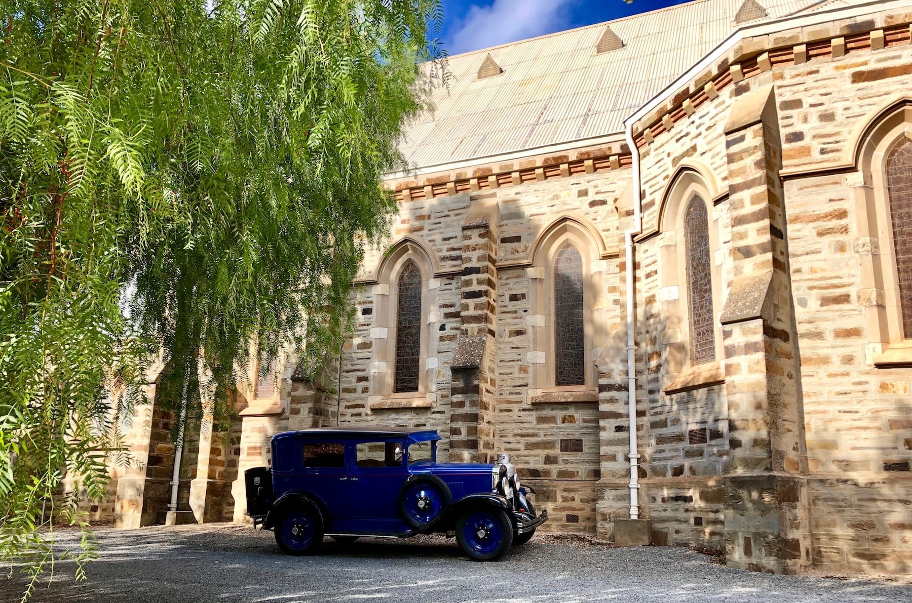 A vintage car outside the catholic church in Burra South Australia.