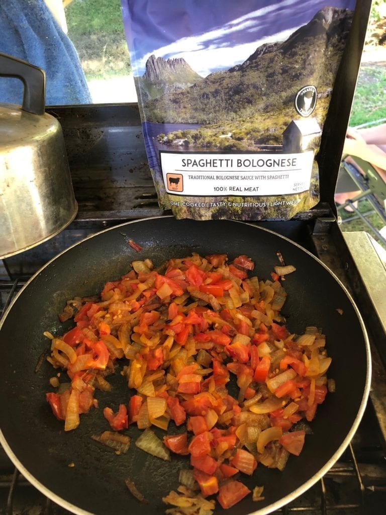 Easy camping meals. Spaghetti Bolgonese from Campers Pantry. We added onions, tomatoes and chillis.