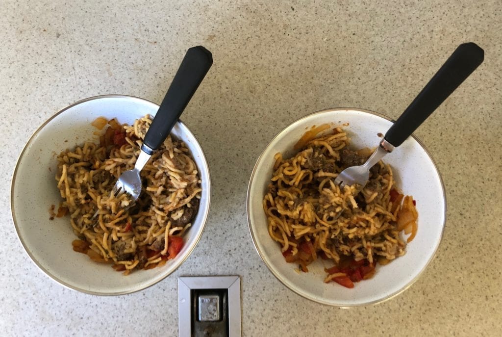 Easy camping meals from Campers Pantry. Spaghetti Bolognese after we added cooked onion, tomatoes and chillis.