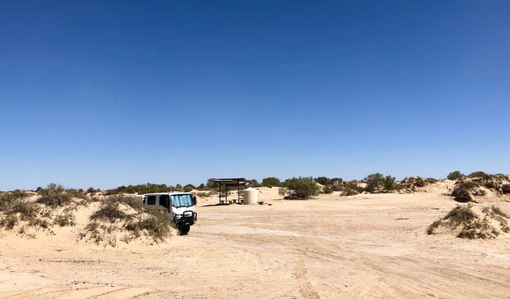 The camping area at Montecollina Bore is tucked amongst strange sand mounds.