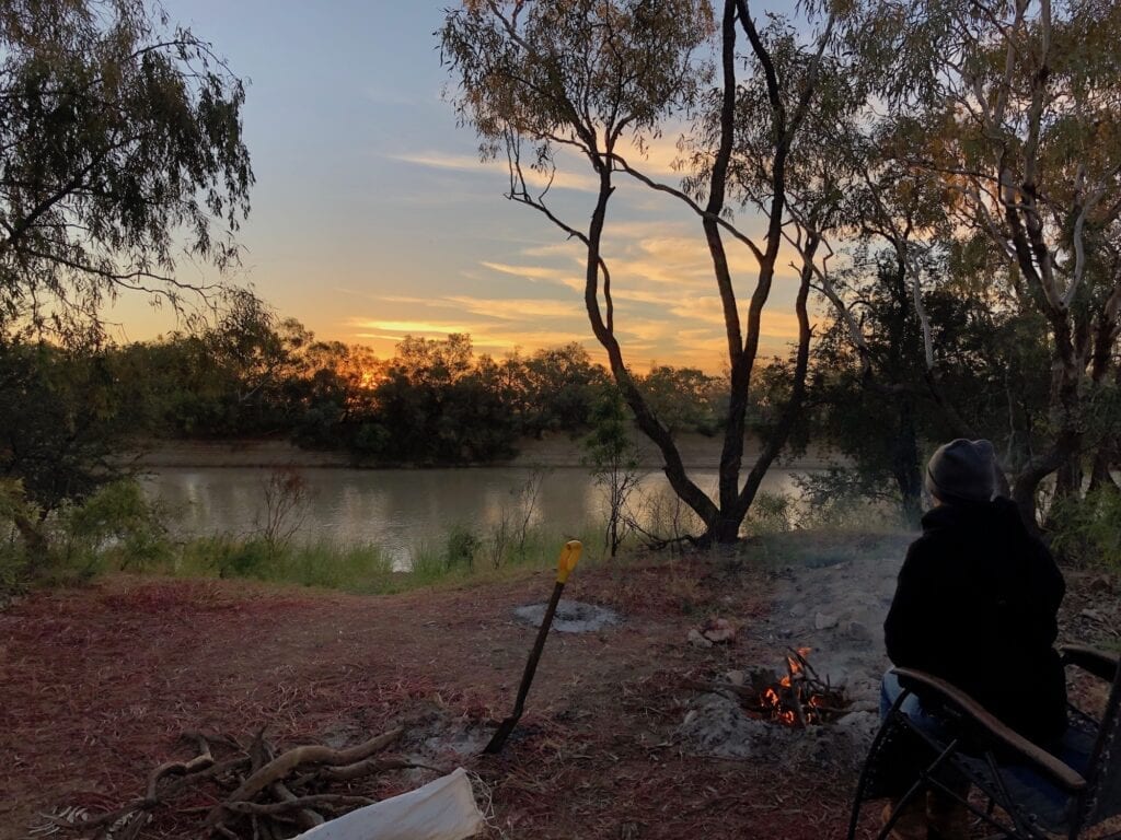 Sunset and a campfire, looking over Cooper Creek QLD.