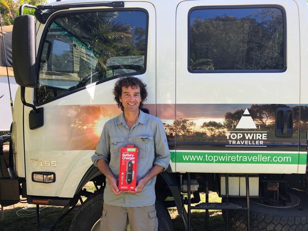 Holding our new REDARC battery charger.