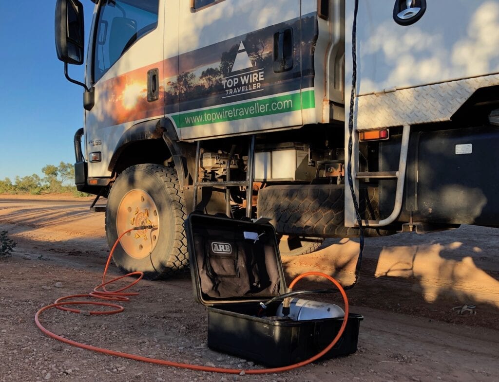 Our ARB twin compressor pumping up the tyres on our Isuzu NPS truck.